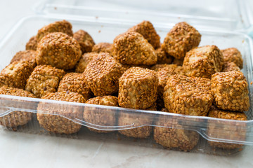 Turkish Salty Bakery Bagel Balls Kahke Simit with Sesame Seeds / Salted Snacks in Plastic Cup Package or Container.