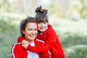 Mother and daughter in park.