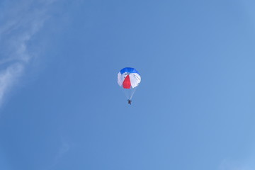 Skydiving. Parachute is in the sky.