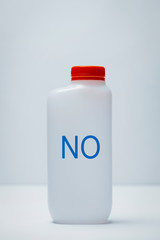 plastic bottle with word no written in it
