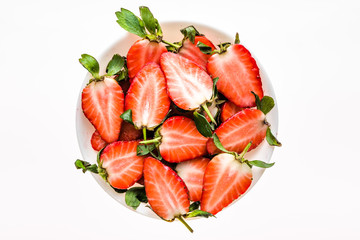 Freshly sliced strawberries on plate, fresh strawberry, top view
