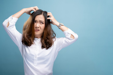 Woman scratching her head