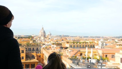Woman with her daughter admire beautiful Rome view