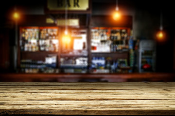 Table background of free space and blurred background of bar 