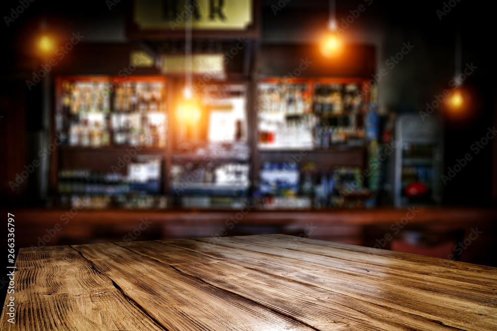 Wall mural table background of free space and blurred background of bar