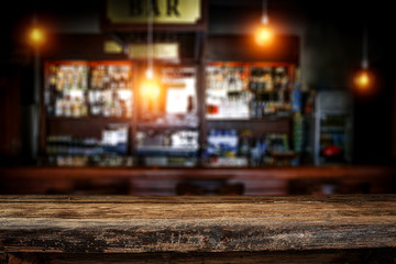 Table background of free space and blurred background of bar  - obrazy, fototapety, plakaty