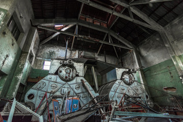 Industrial interior of an old factory, abandoned boilers room