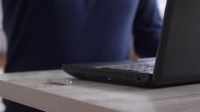 usb data stick, Inserting sd memory card reader into port of computer laptop close-up
