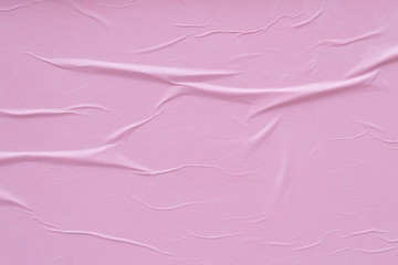 Pink sheet of paper pasted on the wall.