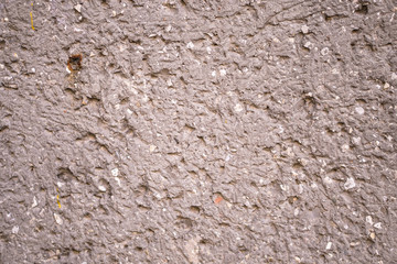 Naklejka premium Uneven texture of stone, cobblestone. Grunge old background for your design