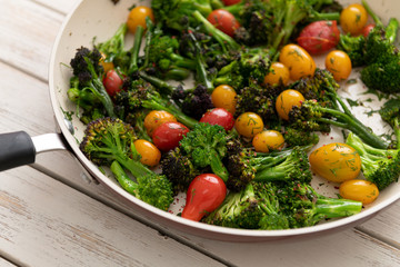 Green Broccoli Florets Sauteed with Heirloom Cherry Tomatoes and Fresh Herbs