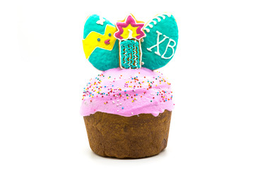 Easter cake with a white cap made of icing and colored powder isolated on white background