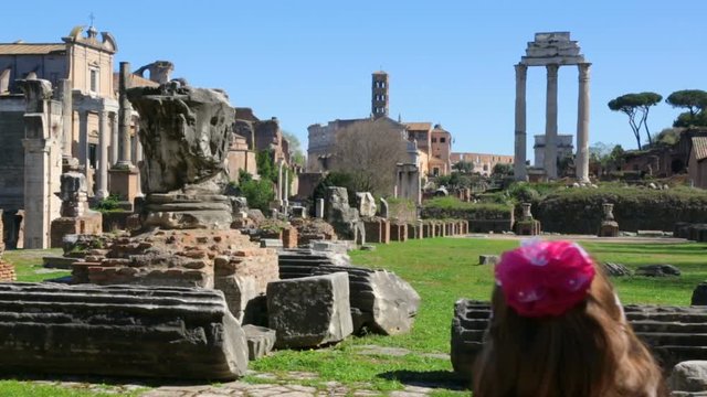 Woman with her daughter admire Roman Forum, Rome, Italy
