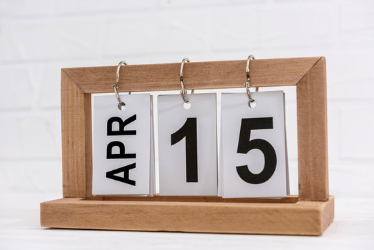 Wooden calendar with date 15th of April, Tax day