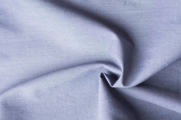 beautiful pure organic cotton fabric laid out in concentric spiral pattern. Elegant blue gray...