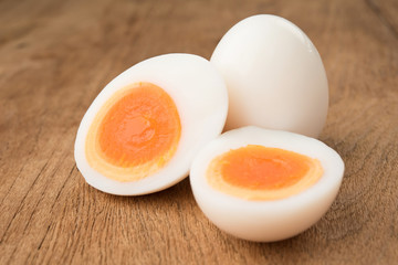 Boiled egg sliced on wooden desk background food object design