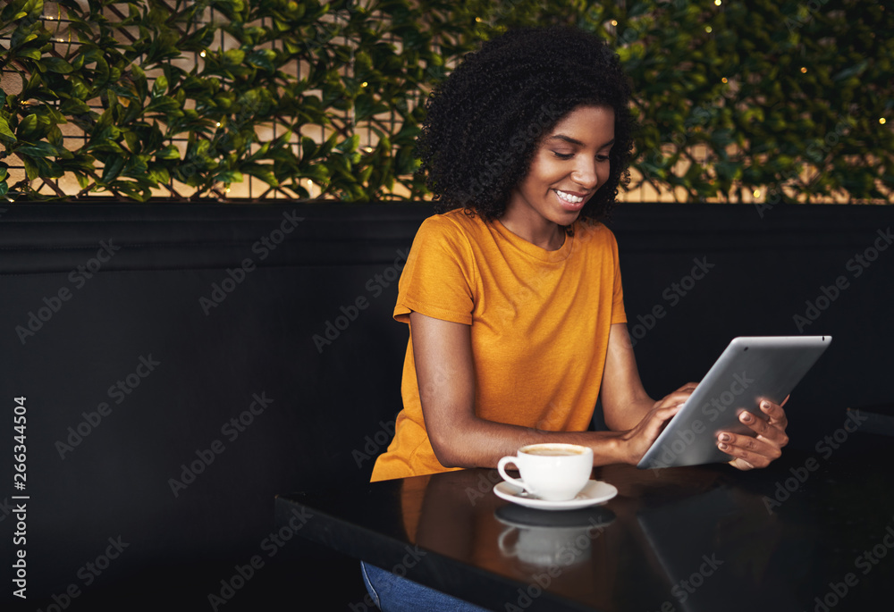 Canvas Prints Woman using digital tablet in cafe