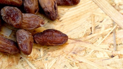 Dates in a wooden box under the afternoon sun