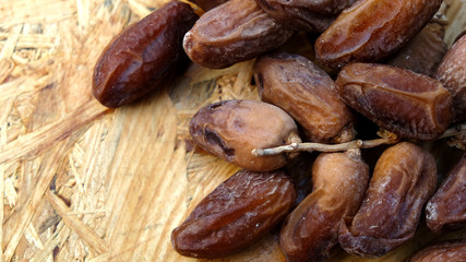 Dates in a wooden box under the afternoon sun