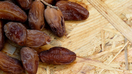 Dates in a wooden box under the afternoon sun