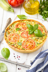 Quiche with vegetables (squash, tomatoes, cheese, herbs, green onions), open tart, French cuisine, traditional pastries