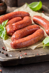 Raw grilled sausages with meat (beef, pork, lamb) and spices, hot merguez, kabanos, chorizo. Delicious food for picnic