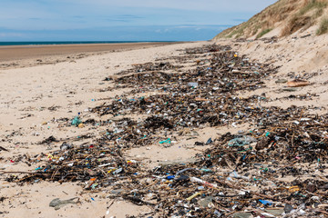 Plastic waste washed up on a beach.