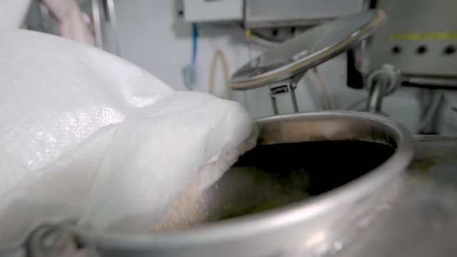 Beer Slowly Rotating in a Large Container
