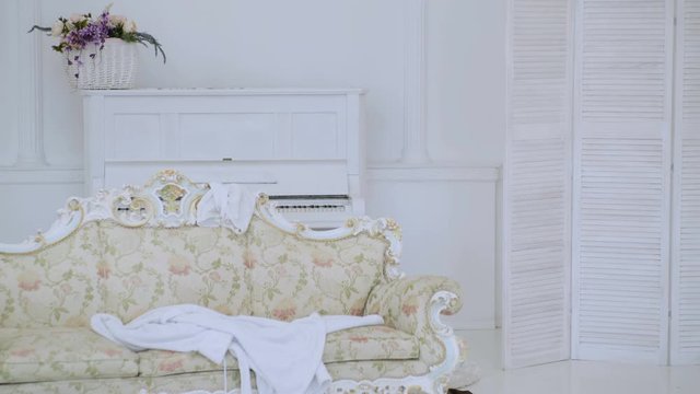 Hipster naked on shocked face unexpectedly detected in bedroom. Exposing lovers concept. Man with beard and mustache hiding behind folding screen. Man, lover in white interior caught naked.
