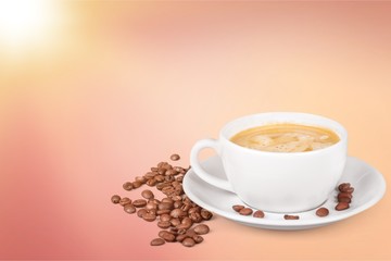 Coffee cup and coffee beans on  background