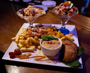 different preparations served on a large plate to share with friends in a pub