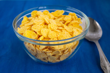  Corn flakes and cover. Quick breakfast. Blue background