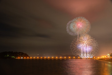 Japanese fireworks over the sea with composition.
