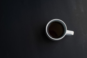 Obraz na płótnie Canvas cup of coffee on black background. soft focus.