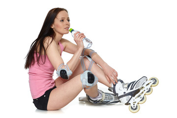 The beautiful young woman in rollerskates.
