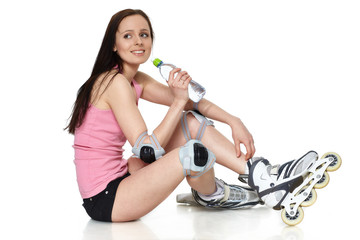 The beautiful young woman in rollerskates.