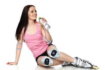 The beautiful young woman in rollerskates.