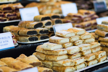 Fresh bakery store in Budapest. Sweet pies on counter with different tastes