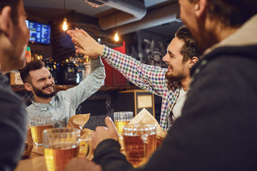 Young people in a meeting in a pub.