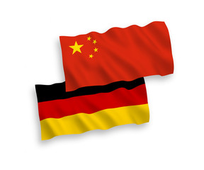 National vector fabric wave flags of Germany and China isolated on white background. 1 to 2 proportion.