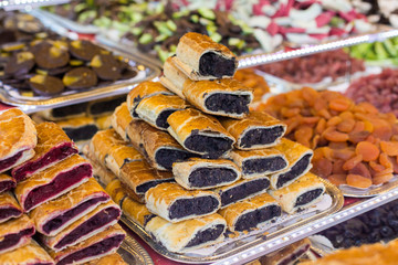 Fresh bakery store in Budapest. Sweet pies on counter with different tastes