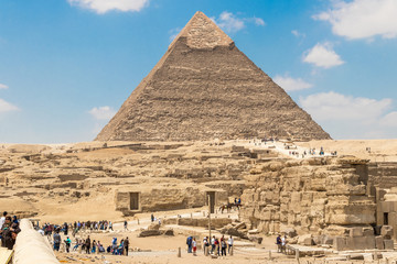Fototapeta na wymiar Giza, Egypt - April 19, 2019: The pyramid of Khafre the second largest of the pyramids of Giza, Egypt
