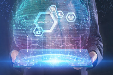 The concept of business, technology, the Internet and the network. A young entrepreneur working on a virtual screen of the future and sees the inscription: Automation
