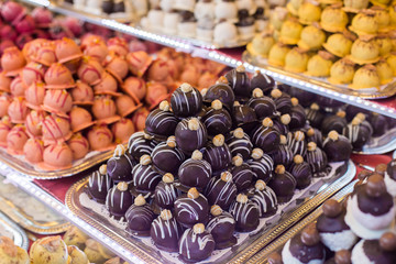 Marсipan store in Budapest. A counter with delicious sweets. Multi-colored marzipans