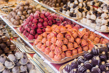 Marсipan store in Budapest. A counter with delicious sweets. Multi-colored marzipans
