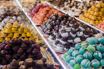 Marсipan store in Budapest. A counter with delicious sweets. Multi-colored marzipans