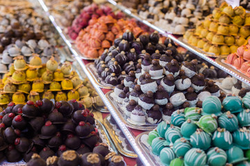 Marсipan store in Budapest. A counter with delicious sweets. Multi-colored marzipans