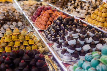 Marсipan store in Budapest. A counter with delicious sweets. Multi-colored marzipans