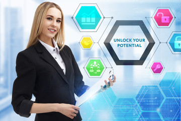 The concept of business, technology, the Internet and the network. A young entrepreneur working on a virtual screen of the future and sees the inscription: Unlock your potential