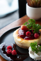 Homemade cheesecake with fresh berries and mint for dessert - healthy organic summer dessert pie cheesecake